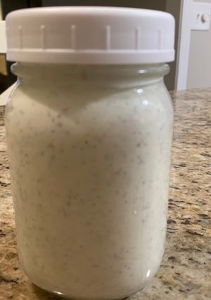 A picture of Ranch dressing and dipping sauce.