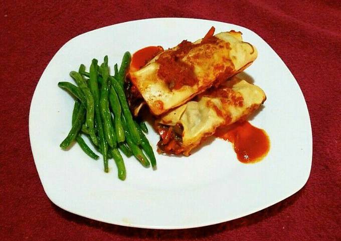 Enchiladas and steamed glazed runner beans