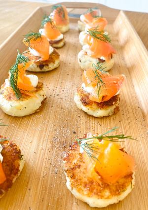 A picture of Potato cakes with dill and smoked salmon (canapé).