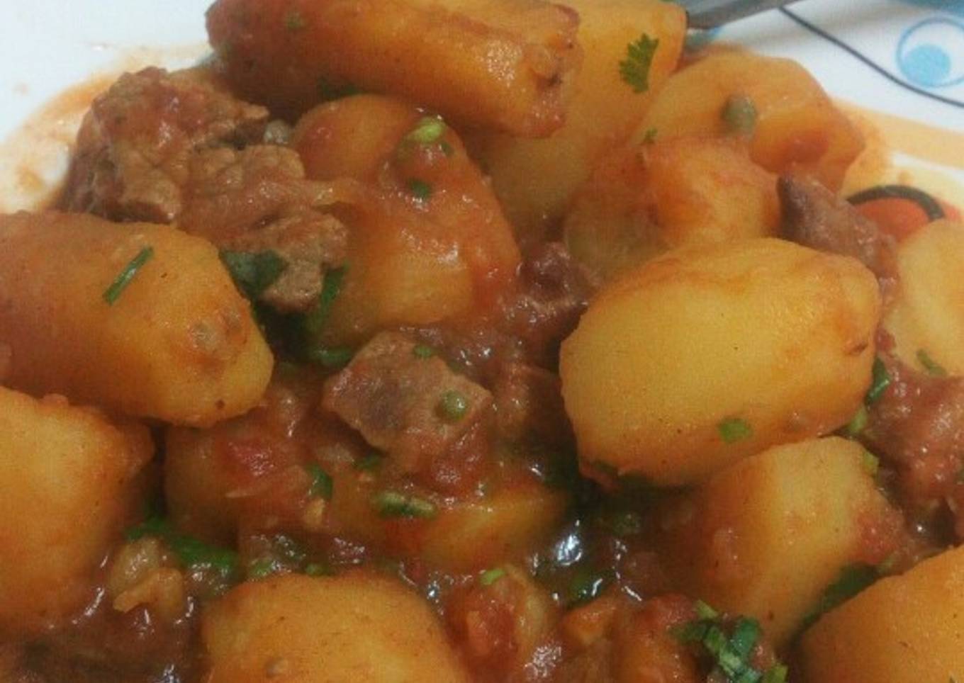 Mix of green bananas,potatoes and meat (matoke)
