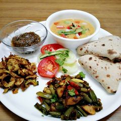 A picture of Healthy aaloo beans sabji,karela fry, chutney,masala oats,roti.