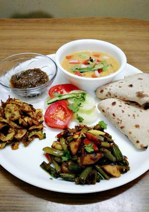 A picture of Healthy aaloo beans sabji,karela fry, chutney,masala oats,roti.