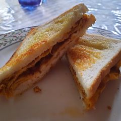 A picture of Cheesy mushroom omelette sandwich.