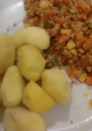 A picture of Boiled irish potatoes with egg sauce.