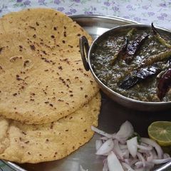 A picture of Sarson Ka saag and makki ki roti authentic dish.