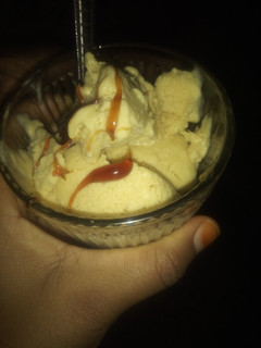 A picture of Banana ice cream with caramel glaze topping.