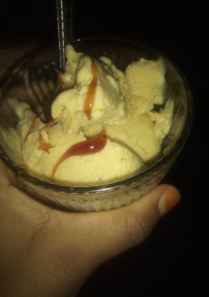 A picture of Banana ice cream with caramel glaze topping.