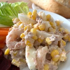 A picture of Tuna & Prawns salad with egg and sweet corns.
