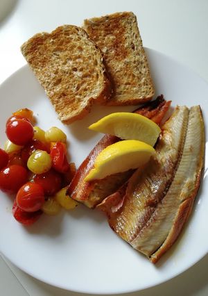 A picture of Freshly Grilled Manx Kippers with Balsamic Mixed Tomatoes.