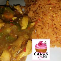 A picture of Jallof Rice With Shredded Chicken.