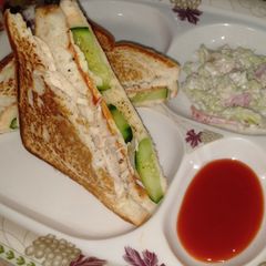 A picture of Sandwiches with coleslaw.
