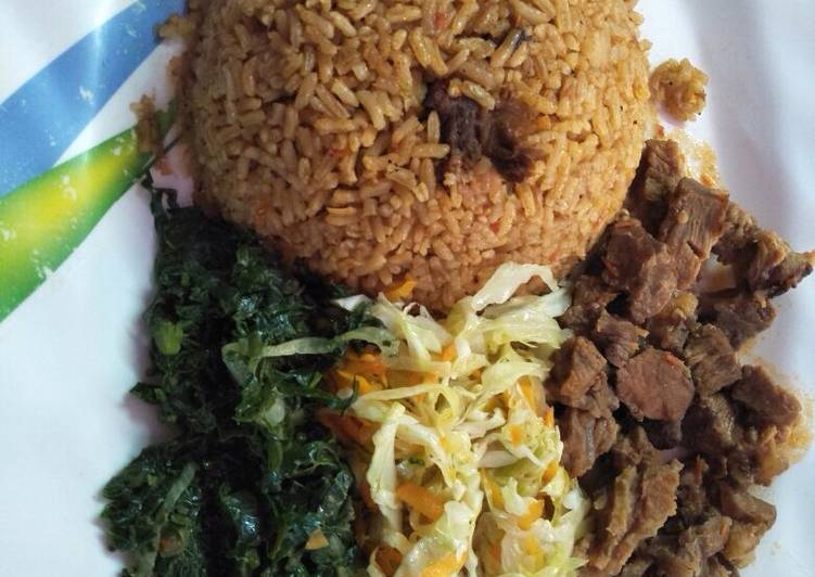 How to Prepare Delicious Pilau served with spinach, wet fried beef and steamed cabbage