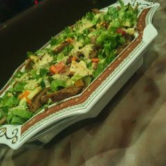 A picture of Beef salad.