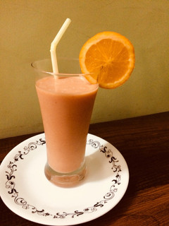 A picture of Papaya-banana -orange smoothie.
