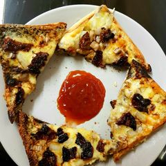 A picture of My New style Of Cheese on toast with Sun dried Tomatoes. 😁.