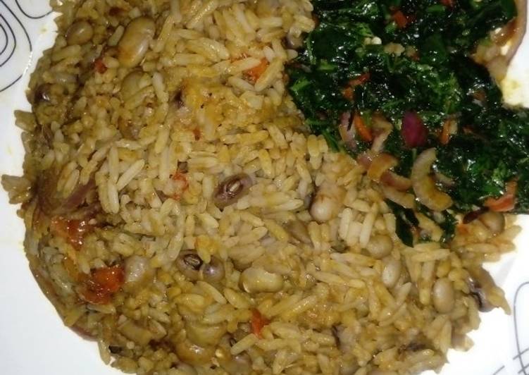Palm Oil Rice and Beans Jellof Garnished with vegetable