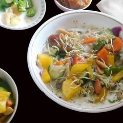 A Healthy Meal with Oats Mixed with Curd and Veggies A picture of A Healthy Meal with Oats Mixed with Curd and Veggies.