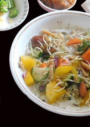 A picture of A Healthy Meal with Oats Mixed with Curd and Veggies.