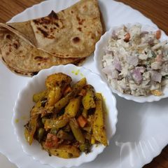 Simple lunch thali with ranch dressing A picture of Simple lunch thali with ranch dressing.