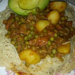 A picture of Pasta and beaf peas stew.
