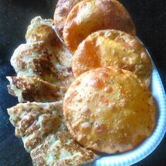 Tomato pamkin puri and egg banana pancake A picture of Tomato pamkin puri and egg banana pancake.