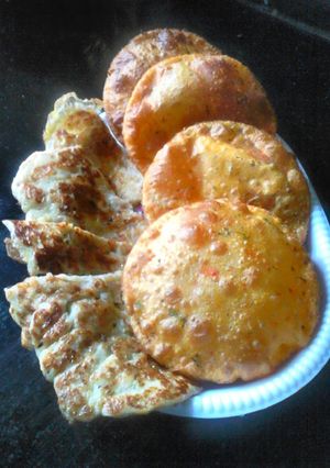 A picture of Tomato pamkin puri and egg banana pancake.