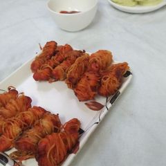 A picture of Noodle wrapped chicken fritters.