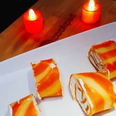 A picture of Orange Marble Swiss Roll.