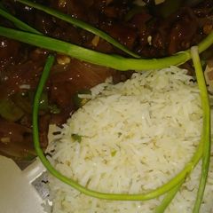 A picture of Garlic rice with beef chilli.