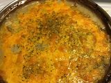 Cheddar, herb and sausage potato au’ gratin
