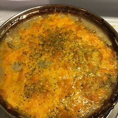 A picture of Cheddar, herb and sausage potato au’ gratin.