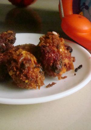 A picture of Red Spinach Fritters with a cheese cracker crust.