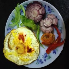A picture of Omelette with salad.