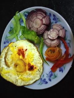 A picture of Omelette with salad.