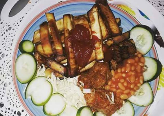 Fried sweet potatoes with cabbage,cucumber and baked beans