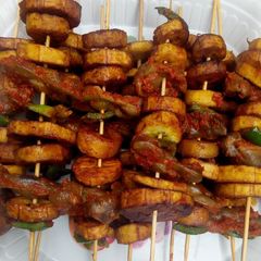 A picture of Plantain and gizard kebab.