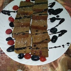 A picture of Organic jaggery cherry cake.