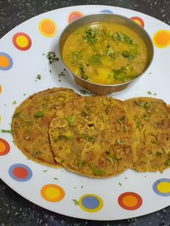A picture of Barley flour masala bhakri {jau} & potato vegetable----- A Desi Platter.