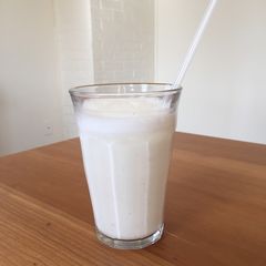 A picture of Cardamon Lassi (yogurt drink) - very simple, refreshing.
