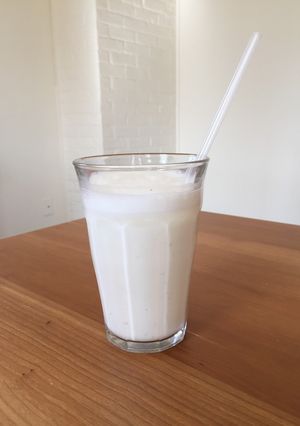 A picture of Cardamon Lassi (yogurt drink) - very simple, refreshing.