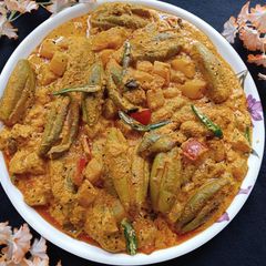 A picture of Parwal Ash gourd Posto Shorshe Curry.