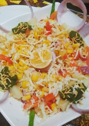 A picture of Boiled corn potatoes cheese chat.