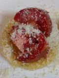 Polenta topped with Parmesan and tomato