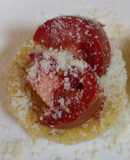 Polenta topped with Parmesan and tomato
