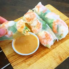 A picture of Prawn Vietnamese rice paper roll and peanut chilli dipping sauce.