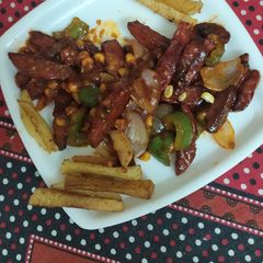 A picture of Chilli potato with French fries.