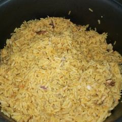 A picture of Coconut Rice with Shredded Chicken and Stockfish.