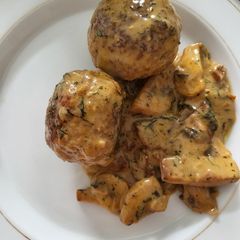 A picture of Meatballs in mushroom cream sauce.