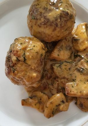 A picture of Meatballs in mushroom cream sauce.