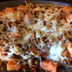 A picture of Flaming Cheesy Sweet Potato Fries.
